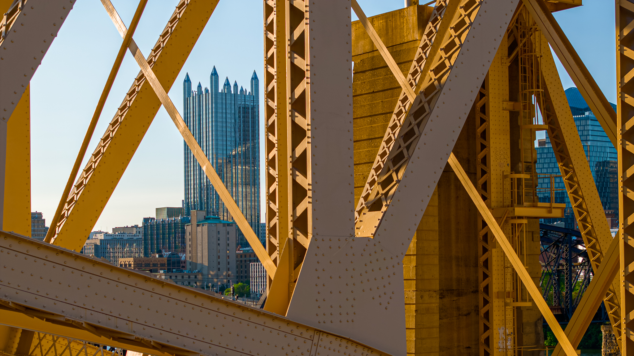 Pittsburgh yellow bridge steel truss with PPG Place in background