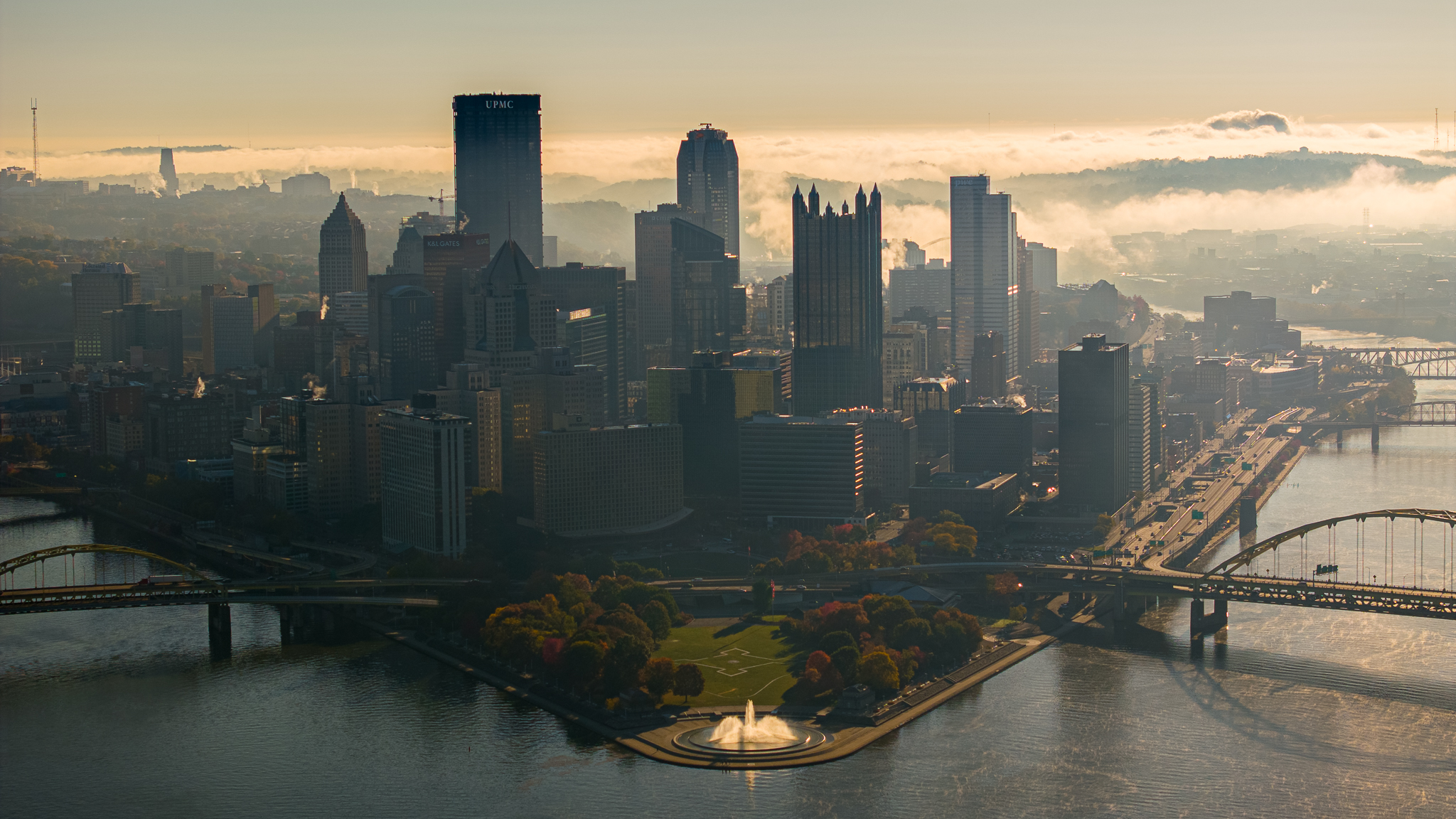 Point State Park fountain on a misty morning with Pittsburgh skyline